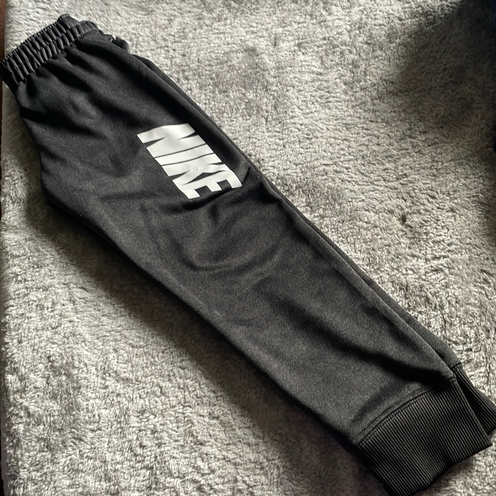 Boys Nike Dri-Fit track pants.